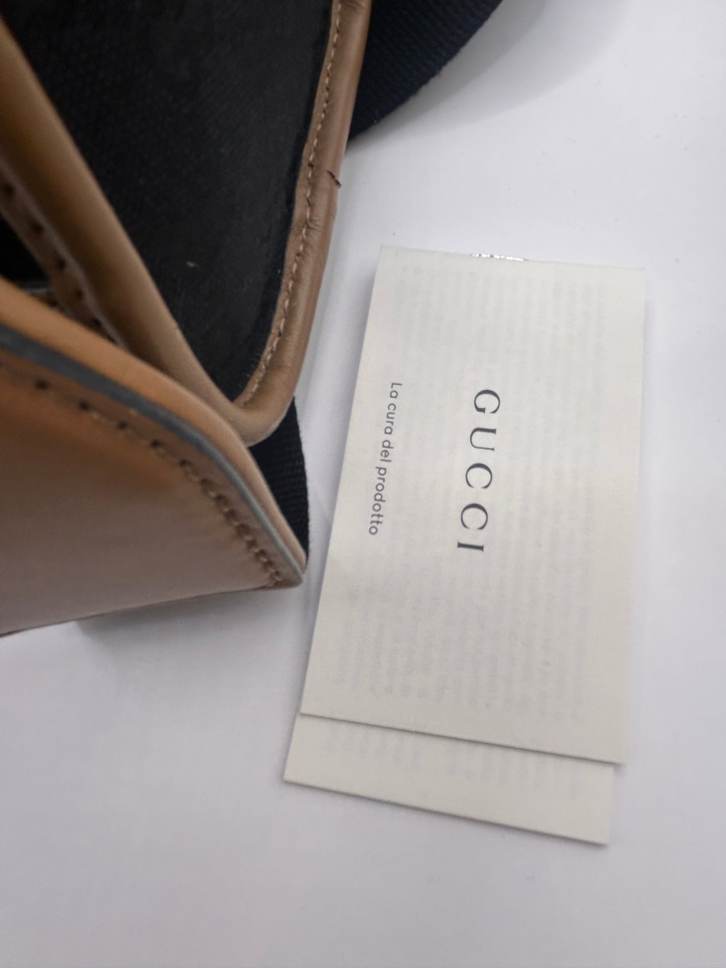 Gucci Bauletto mini top handle bag in black GG canvas and tan leather trim.