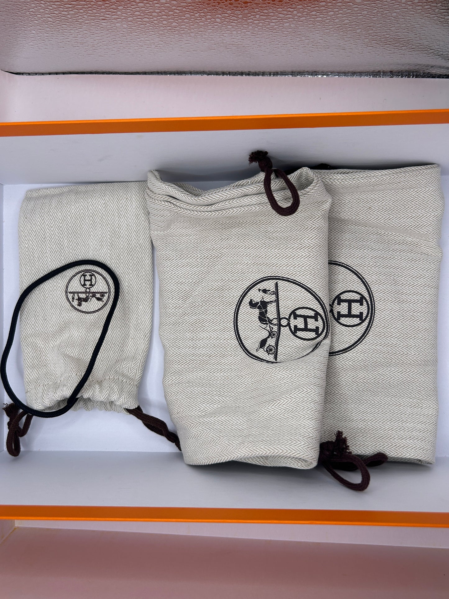 Hermès Addict knit fabric and suede sneakers in black and white