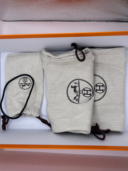 Hermès Addict knit fabric and suede sneakers in black and white