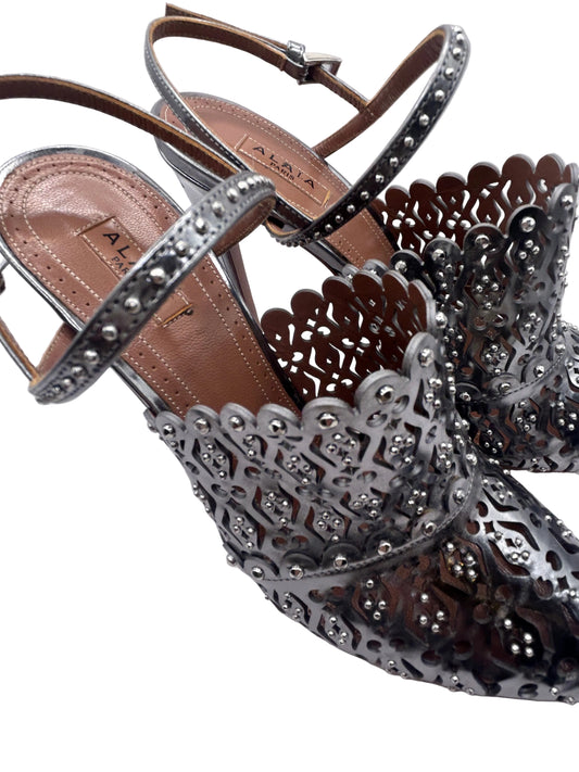 ALAIA Laser-Cut Studded
Pumps, Silver