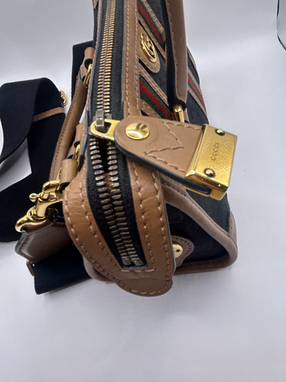 Gucci Bauletto mini top handle bag in black GG canvas and tan leather trim.