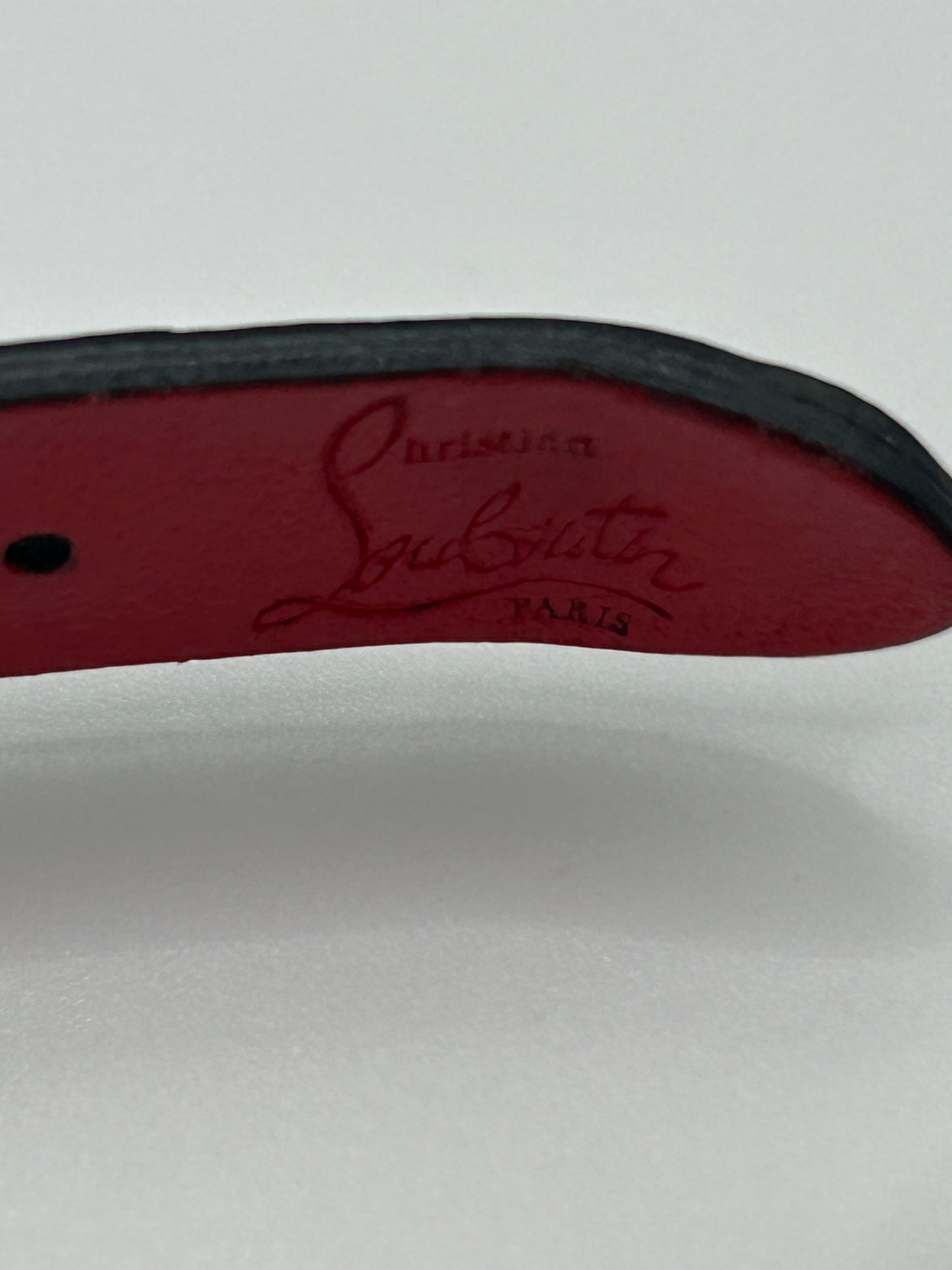 CHRISTIAN LOUBOUTIN
Loubilink spike-embellished leather bracelet