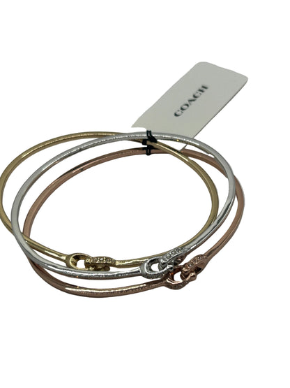 Coach Interlocking Signature C Stone Bangle Bracelet Set in tri-tone metal with crystal details