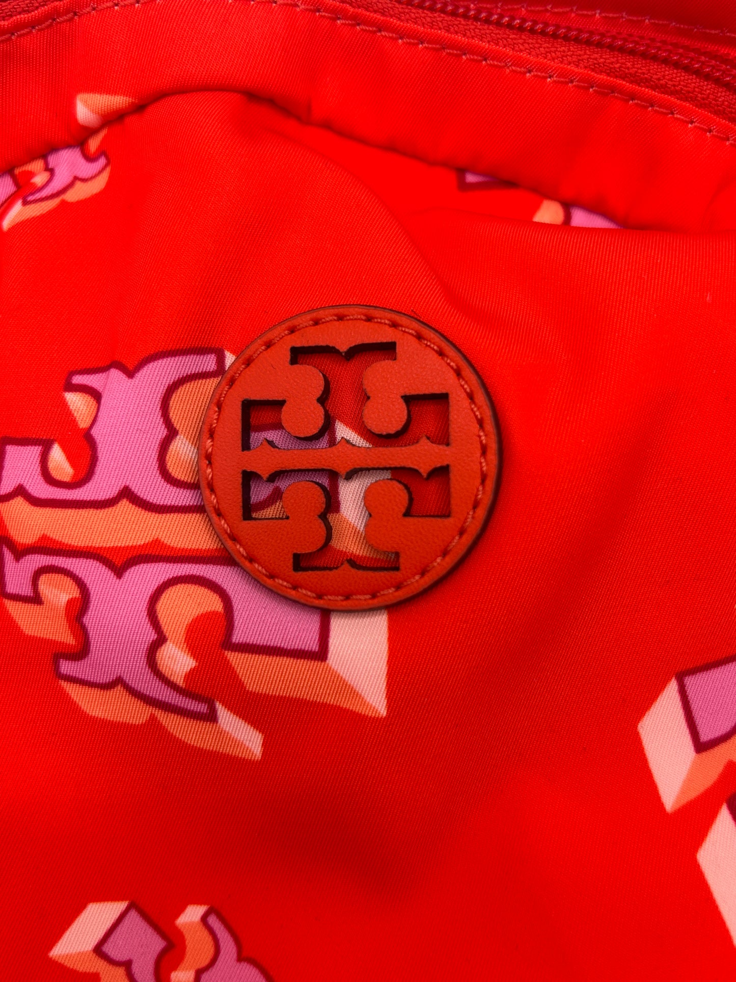 Tory Burch Ella Printed Backpack featuring a crazy logo allover pattern