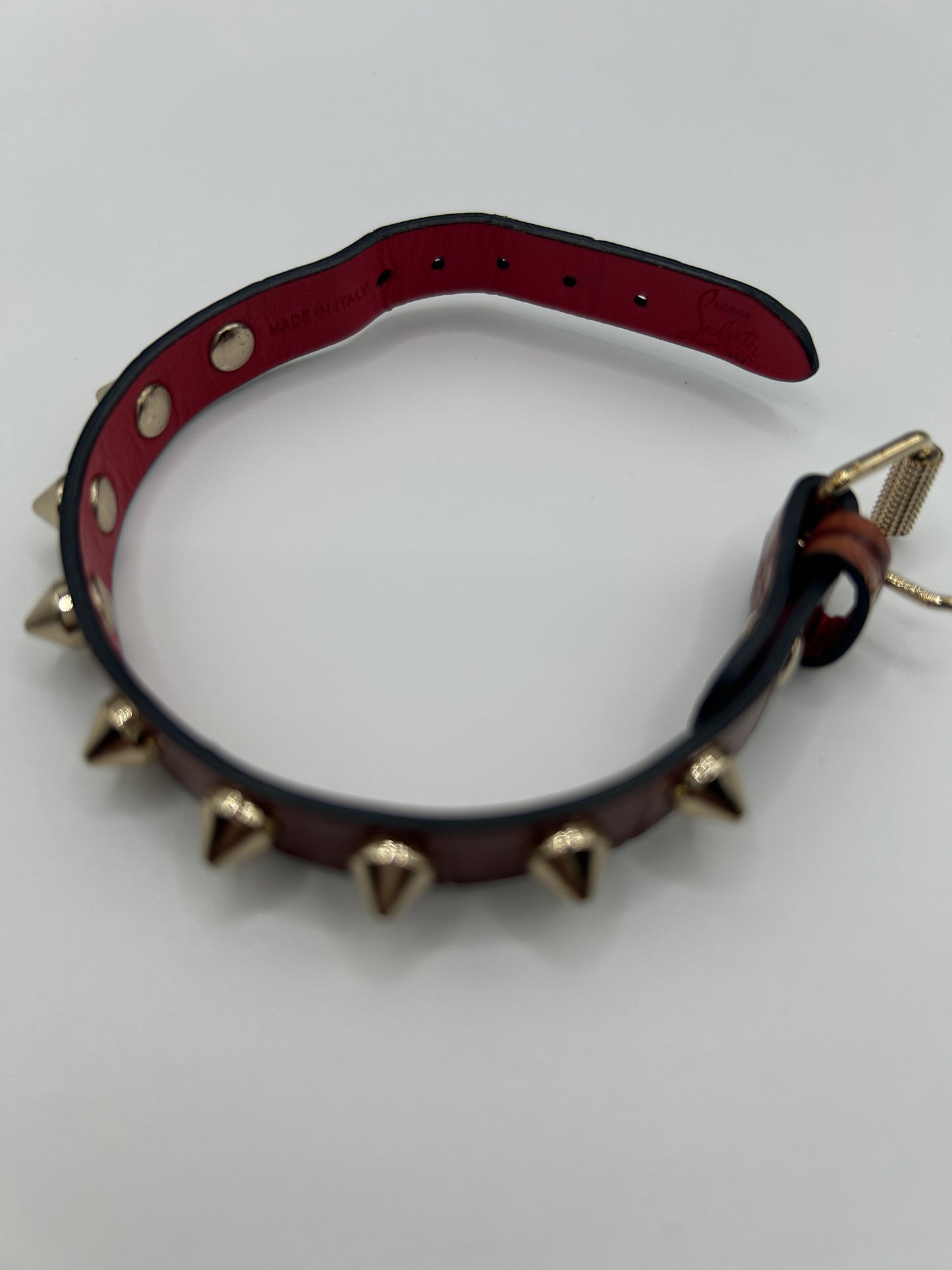 CHRISTIAN LOUBOUTIN
Loubilink spike-embellished leather bracelet