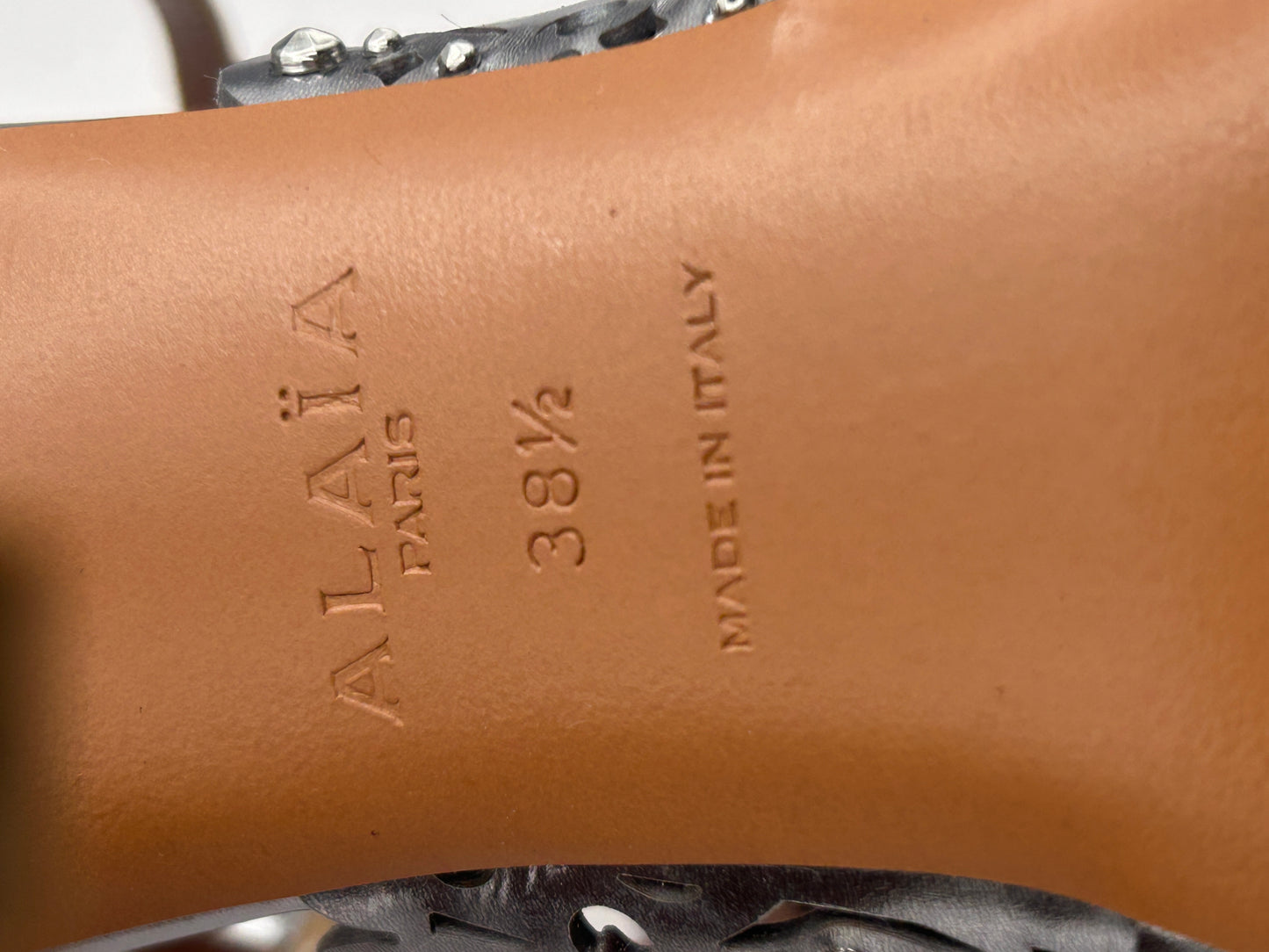 ALAIA Laser-Cut Studded
Pumps, Silver