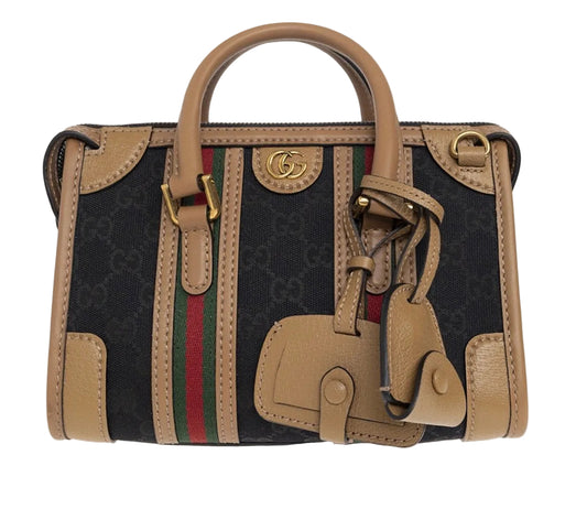 Gucci Bauletto mini top handle bag in black GG canvas and tan leather trim.