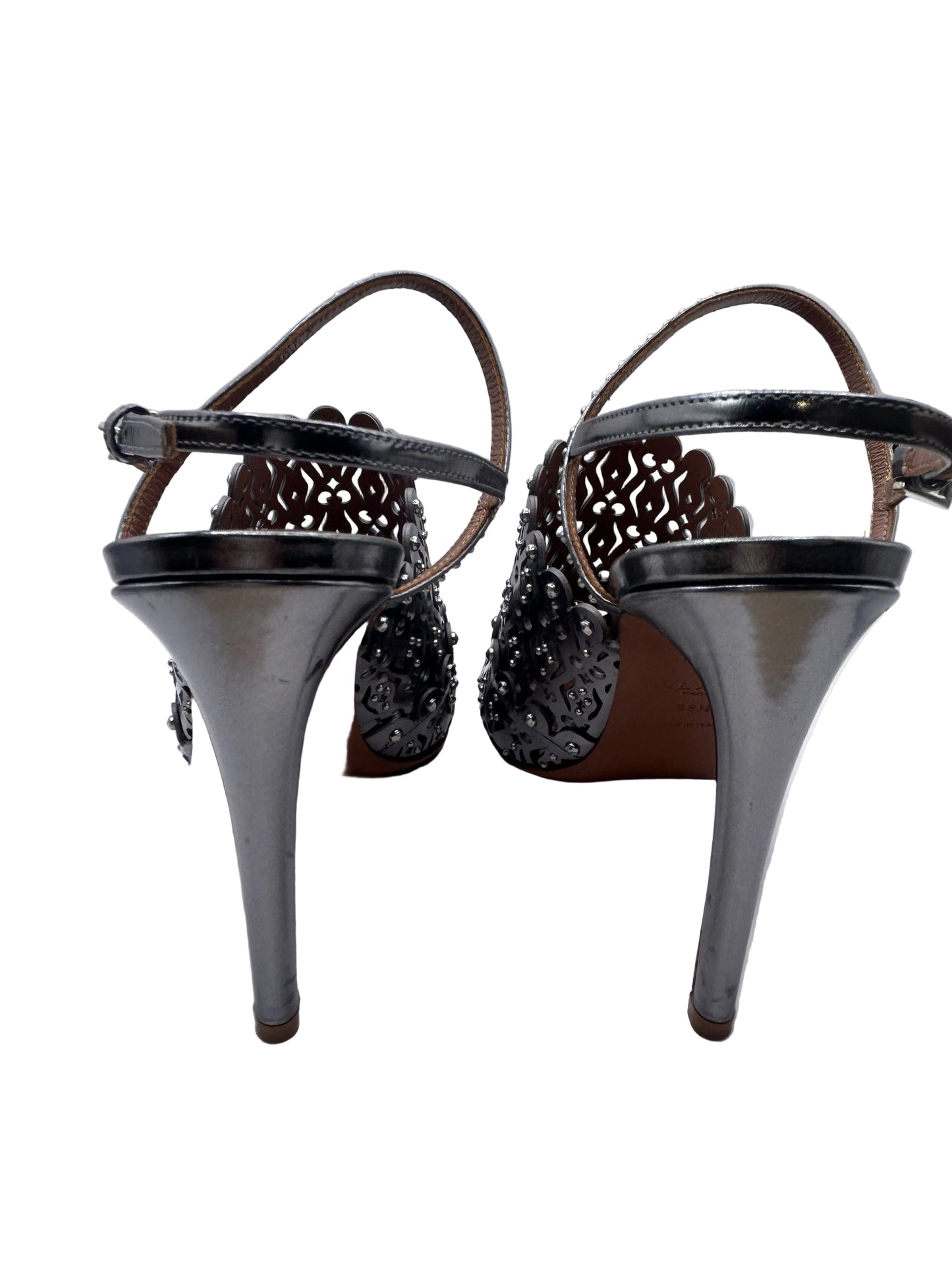 ALAIA Laser-Cut Studded
Pumps, Silver
