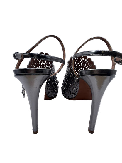 ALAIA Laser-Cut Studded
Pumps, Silver