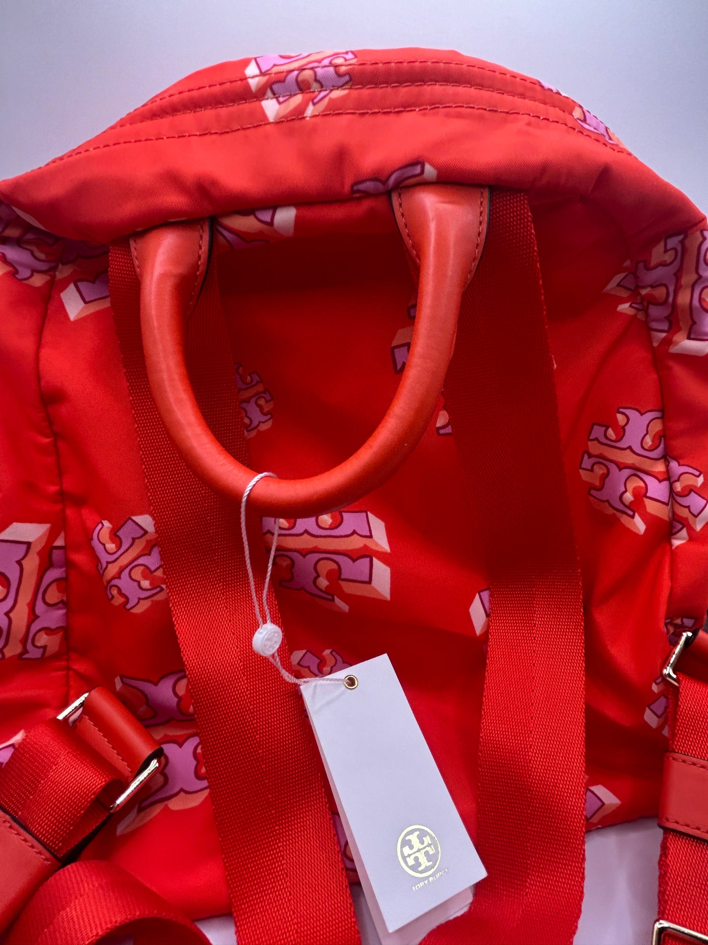 Tory Burch Ella Printed Backpack featuring a crazy logo allover pattern