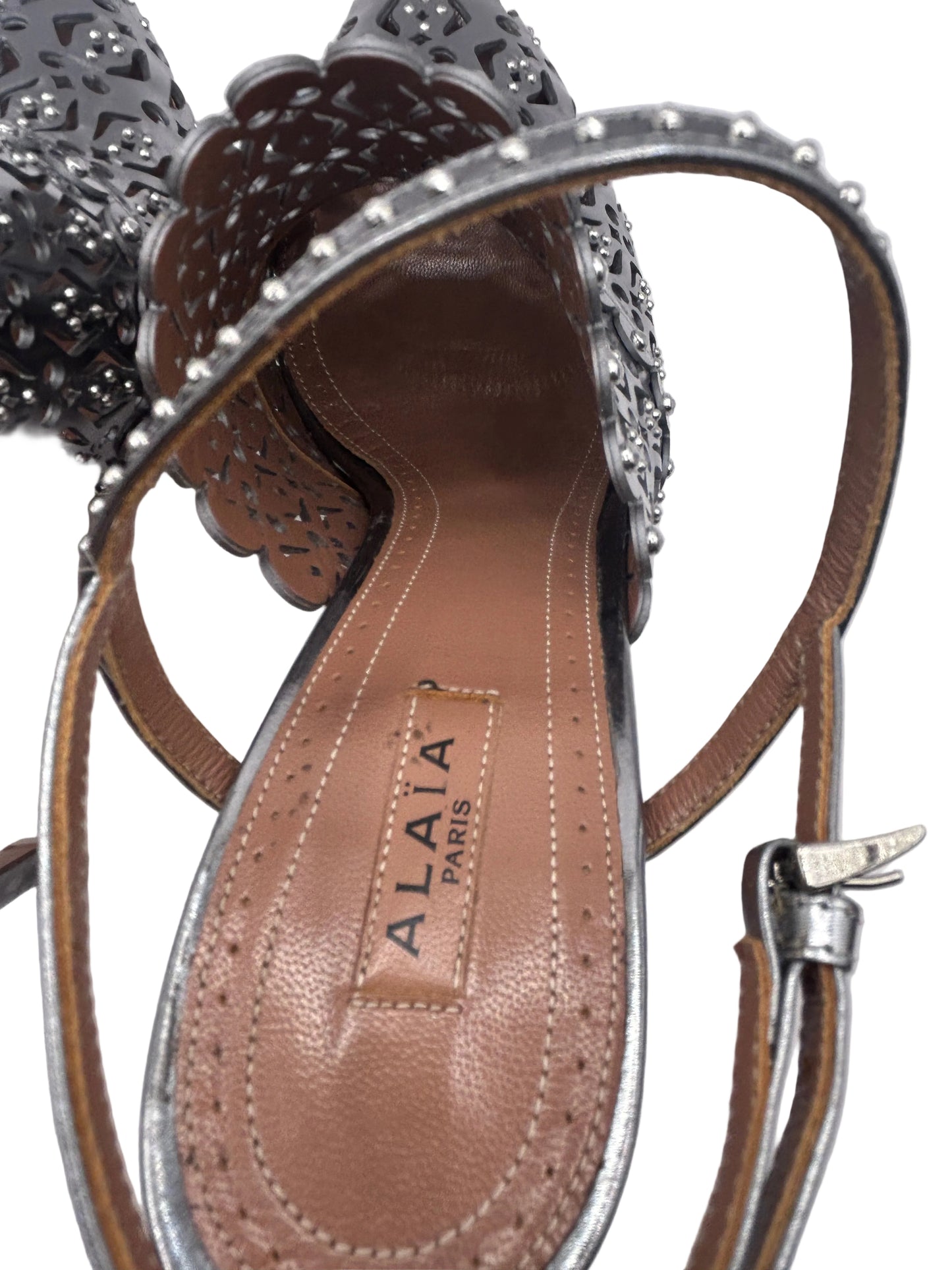 ALAIA Laser-Cut Studded
Pumps, Silver