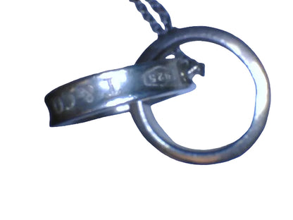 Tiffany & Co. 1837
Interlocking Circles Pendant in sterling silver, highlighted by its signature engraved hallmark and interlocking ring design.