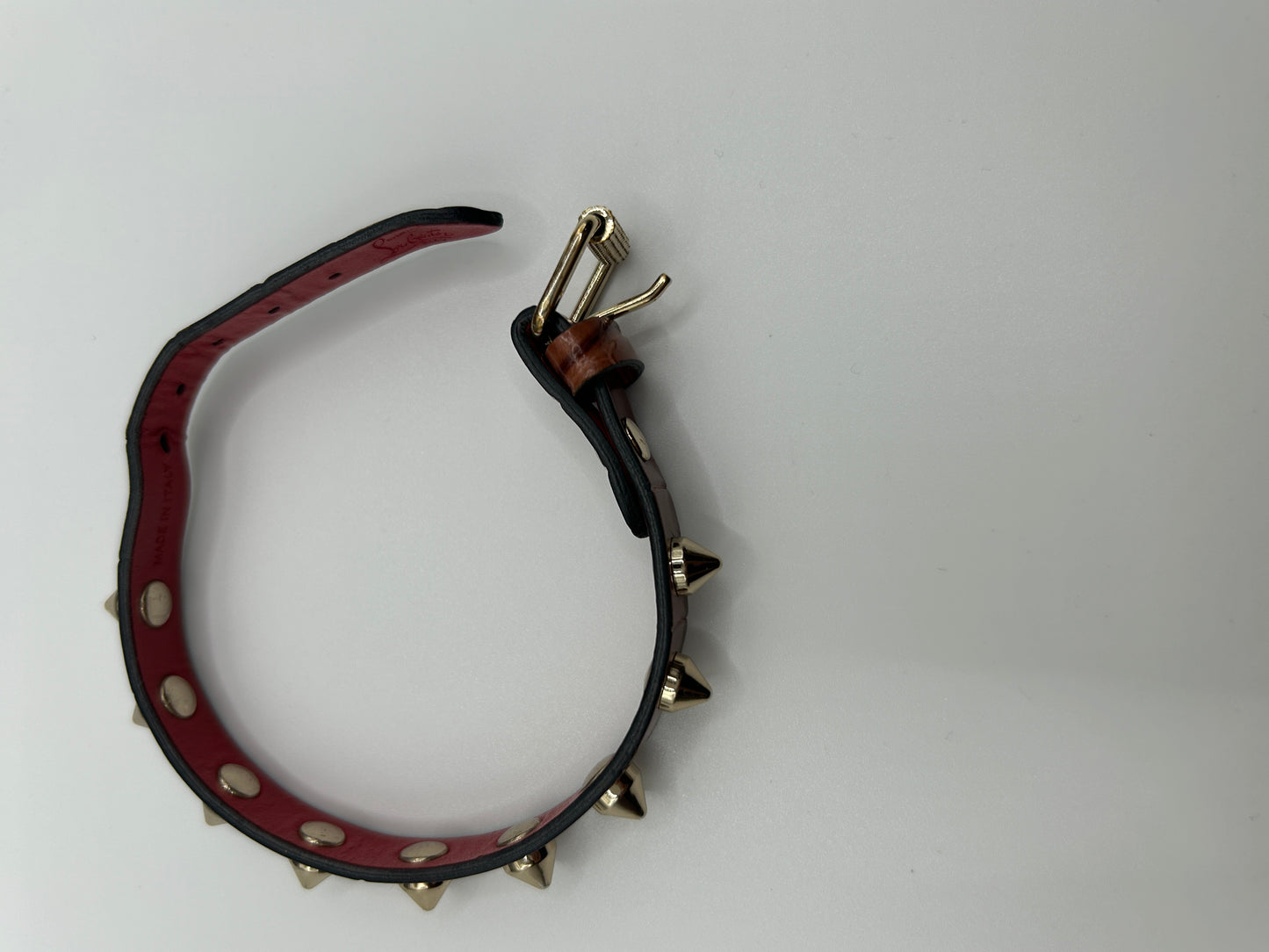 CHRISTIAN LOUBOUTIN
Loubilink spike-embellished leather bracelet