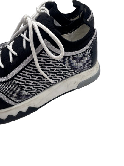 Hermès Addict knit fabric and suede sneakers in black and white