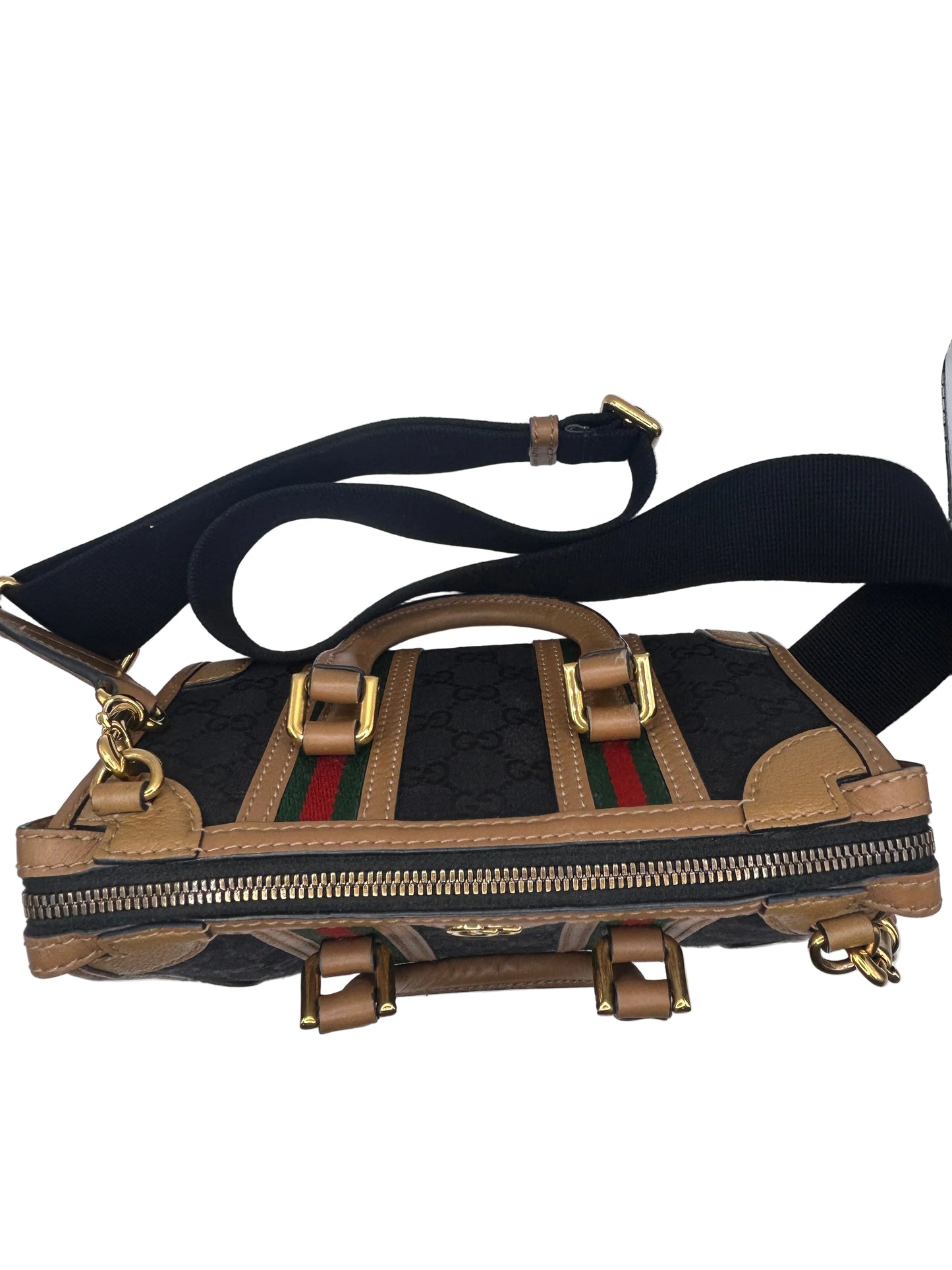 Gucci Bauletto mini top handle bag in black GG canvas and tan leather trim.