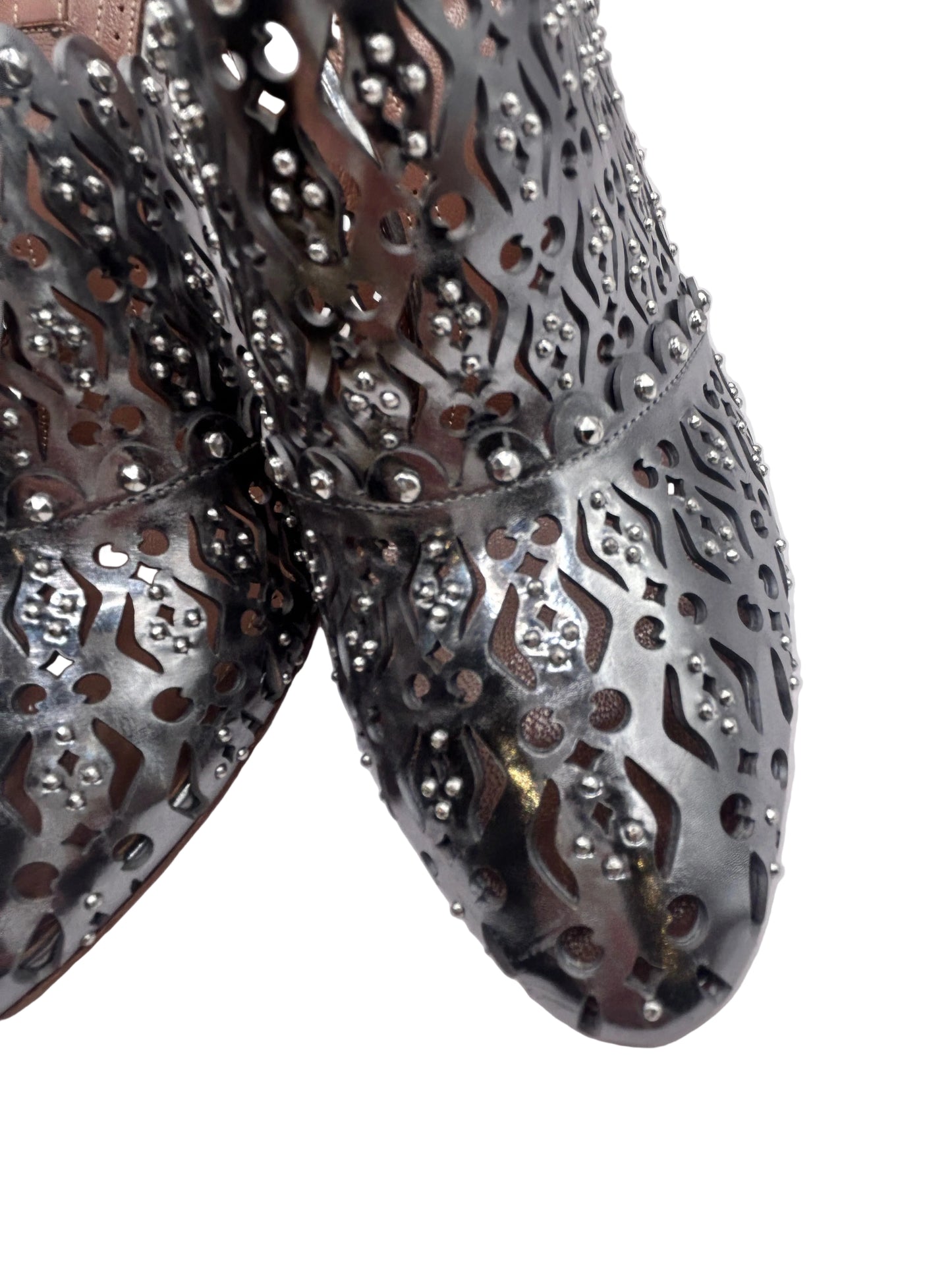ALAIA Laser-Cut Studded
Pumps, Silver