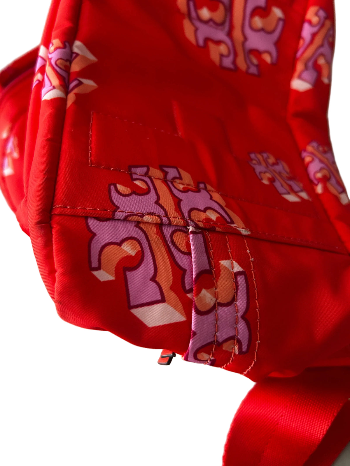 Tory Burch Ella Printed Backpack featuring a crazy logo allover pattern