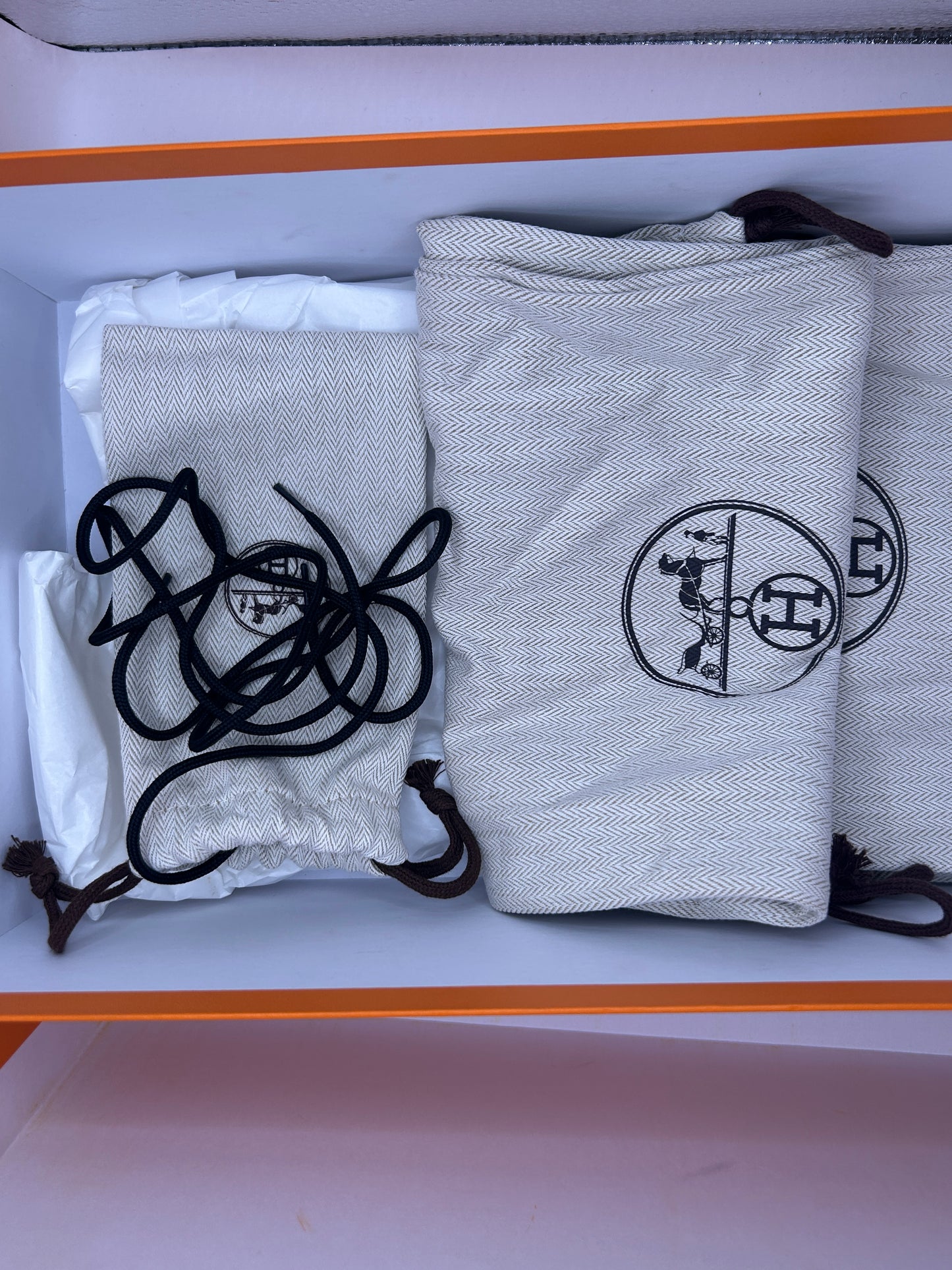 Hermès Addict knit fabric and suede sneakers in black and white