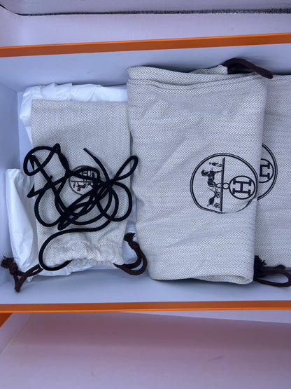 Hermès Addict knit fabric and suede sneakers in black and white