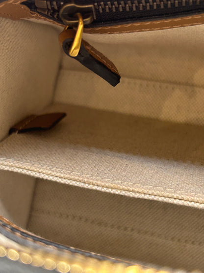 Gucci Bauletto mini top handle bag in black GG canvas and tan leather trim.