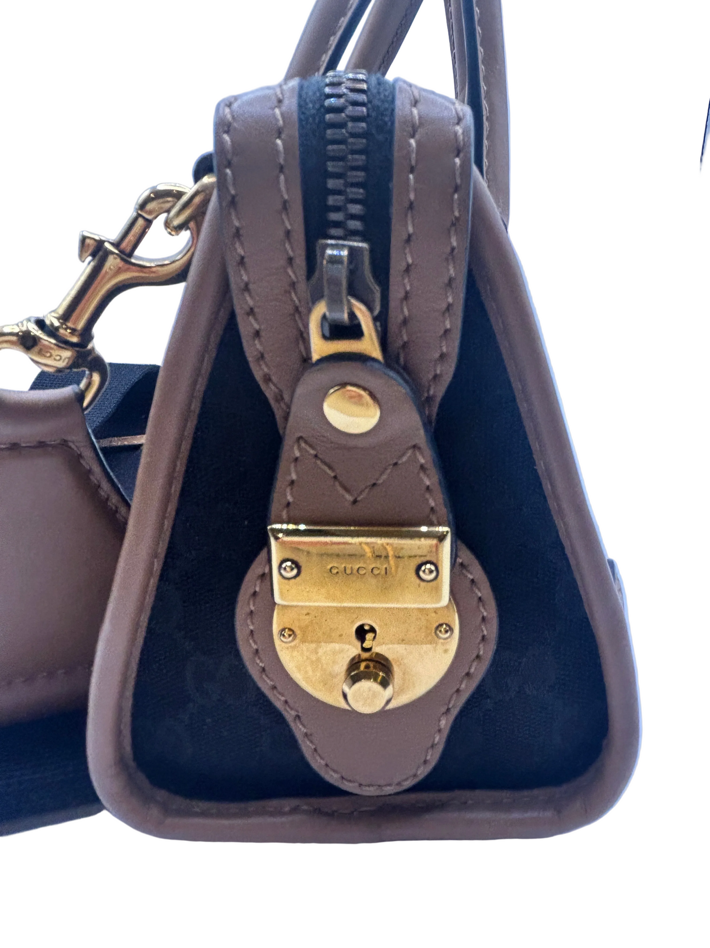 Gucci Bauletto mini top handle bag in black GG canvas and tan leather trim.