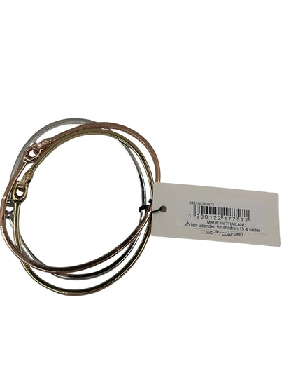 Coach Interlocking Signature C Stone Bangle Bracelet Set in tri-tone metal with crystal details