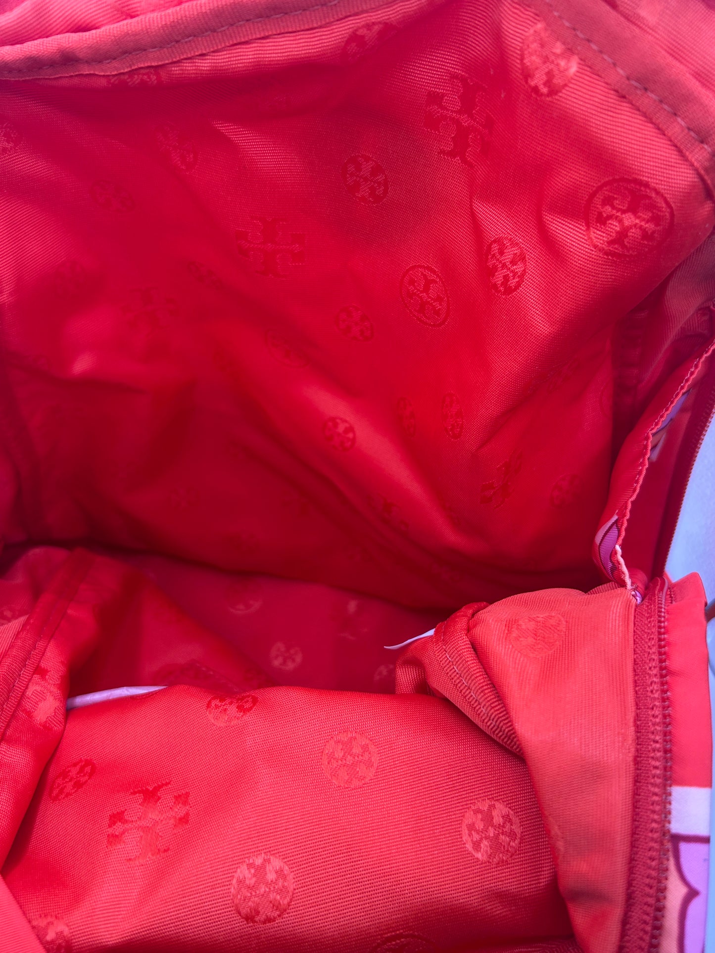 Tory Burch Ella Printed Backpack featuring a crazy logo allover pattern